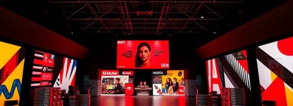 bold socialmedia branding, expressive expression, redefining identity, photorealistic, design studio filled with branding showcases, highly detailed, bold graphic elements, sharp contrasts, primary colors, spotlight illumination, shot with a prime lens.